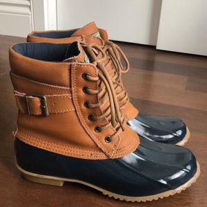 Brown and navy duck boots